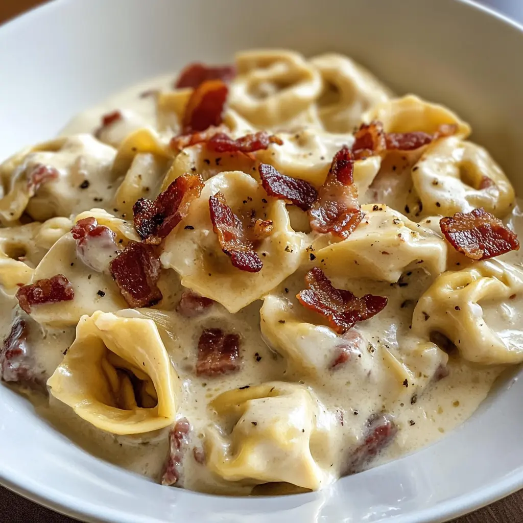 bacon cream cheese tortellini, creamy tortellini recipes, savory tortellini dishes, easy dinner recipes, pasta with bacon, indulgent pasta recipes, comfort food, quick weeknight meals, bacon recipes, cheese-filled pasta recipes