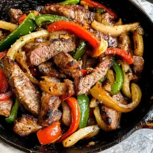 pepper steak, skillet recipes, easy dinner recipes, beef stir-fry, one-pan meals, weekday dinner, savory beef dishes